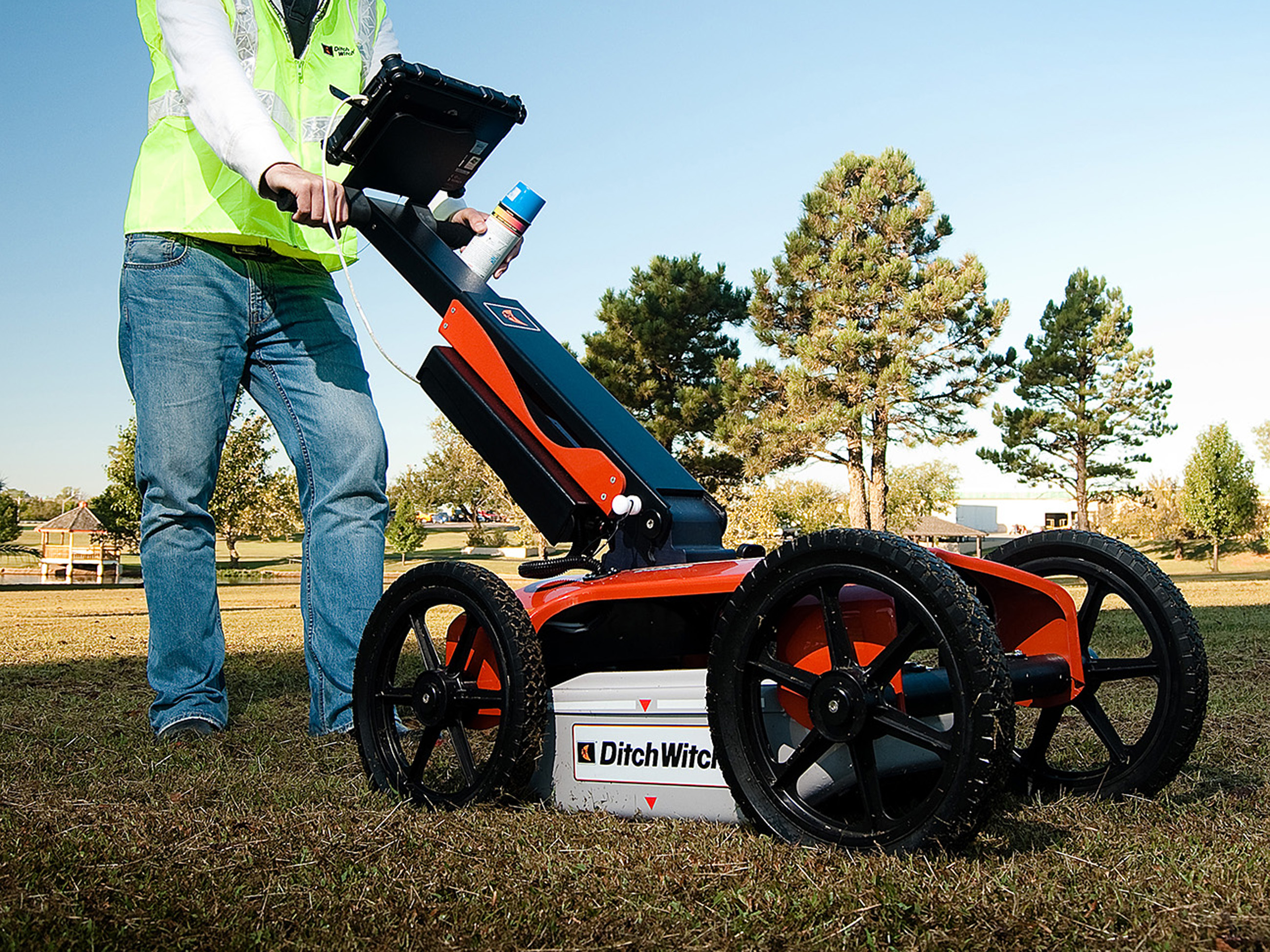 Field technician using ground penetrating radar equipment